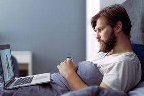 Man listening to medical worker