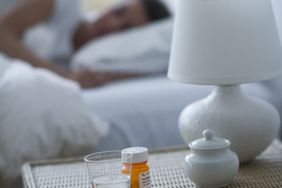 woman-sleeping-pills-bed