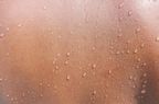 generalized hyperhidrosis , Water drops on woman skin, close up of wet human skin texture