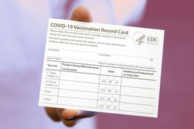 Your COVID-19 Vaccine Card, What to Do if You Lose It, Why You Shouldn't Laminate It, and Other Important Info , BOSTON - DECEMBER 16: Elizabeth Hafted, Pharmacist displays a COVID-19 Vaccination Record Card at Beth Israel Deaconess Medical Center in Boston on Dec. 16, 2020. (Photo by Jessica Rinaldi/The Boston Globe via Getty Images)