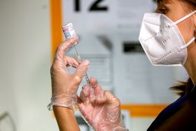 A healthcare worker prepares a dose of the Moderna Covid-19 at the Brooklyn Children's Museum vaccination site, serving children six months to 5-Years old, in the Brooklyn borough of New York, US, on Thursday, June 23, 2022. Covid-19 vaccines for children under 5 years old were authorized by the US Food and Drug Administration on Friday and by the Centers for Disease Control and Prevention on Saturday, a welcome relief to parents of the last age group to become eligible for shots.