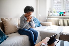 person experiencing symptoms of a viral infection
