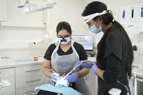 person getting a wisdom teeth removal surgery 